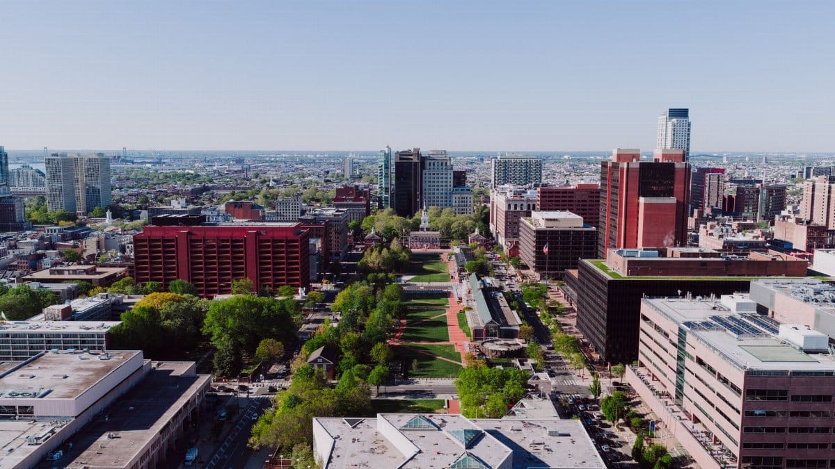 A stunning aerial view showcasing downtown Philadelphia with iconic buildings and greenery.