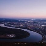Stunning aerial view of Chattanooga, Tennessee at twilight showcasing the city and surrounding river.