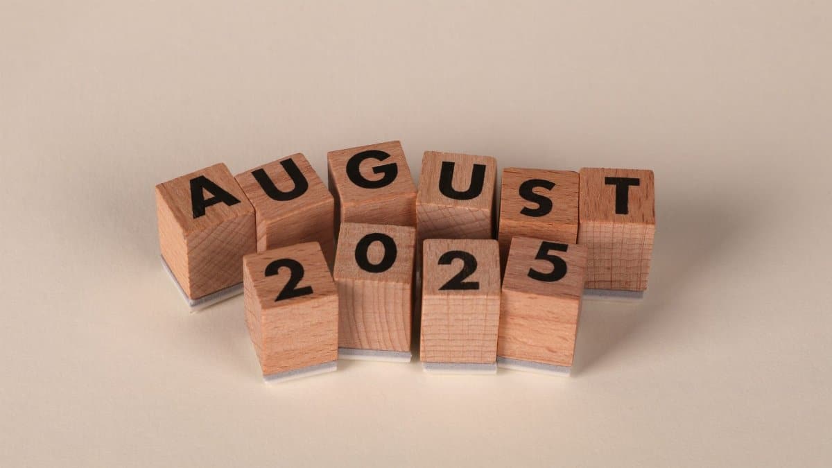 Wooden blocks arranged to spell 'August 2025' on a neutral background.
