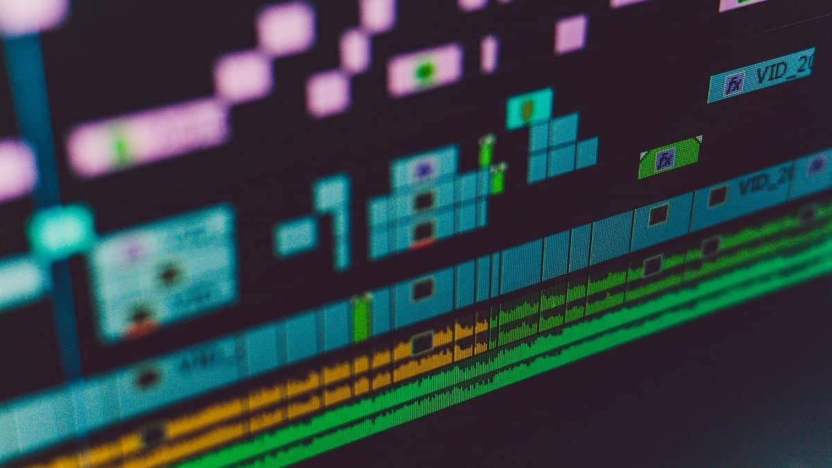 Detailed view of a video editing software interface showing multi-track timeline and colorful design.