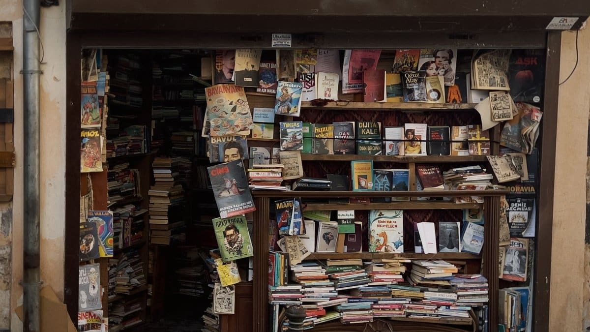 A front view of an old bookstore with a vibrant and eclectic mix of books and posters.
