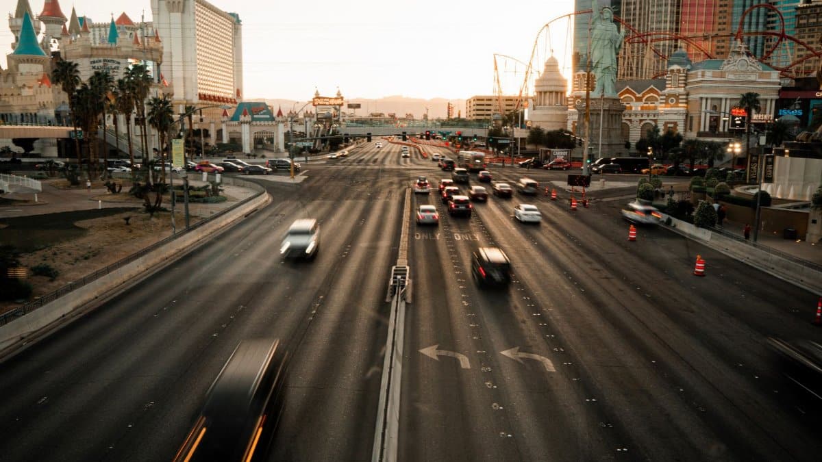 Aerial view of the busy Las Vegas Strip with iconic landmarks during sunset.