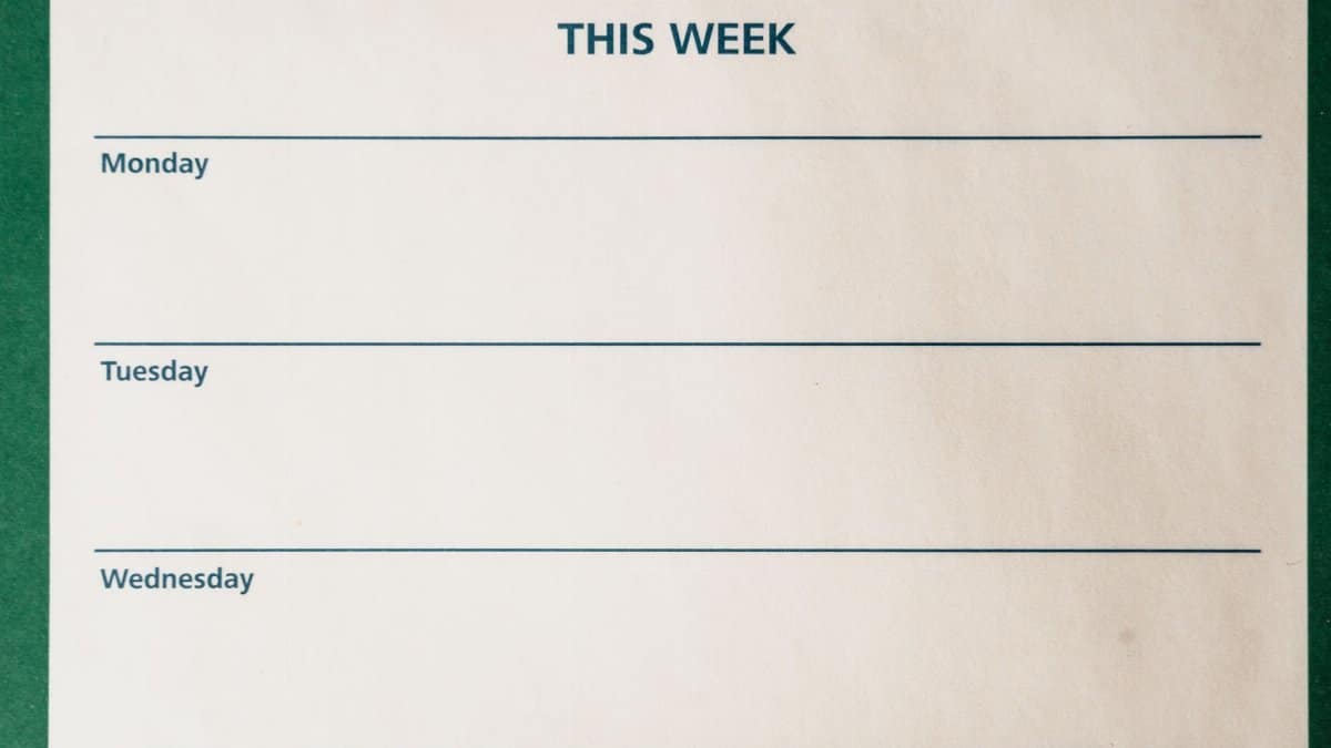 Minimalist blank weekly planner with days for scheduling and organizing tasks.