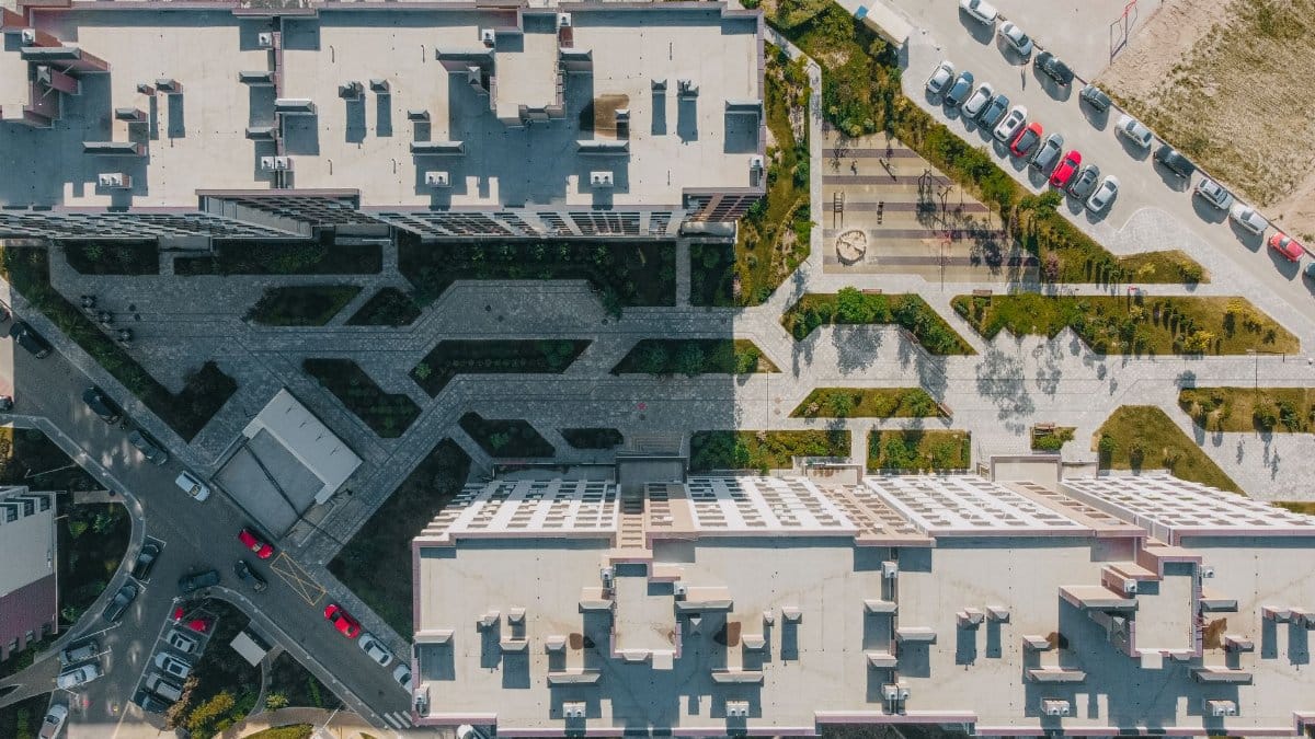 Aerial shot showcasing modern urban architecture and green spaces in Kyiv, Ukraine.