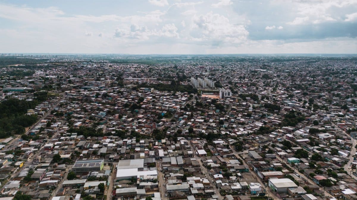 Expansive aerial view of São José Operário, showcasing dense urban architecture in Manaus, Brazil.