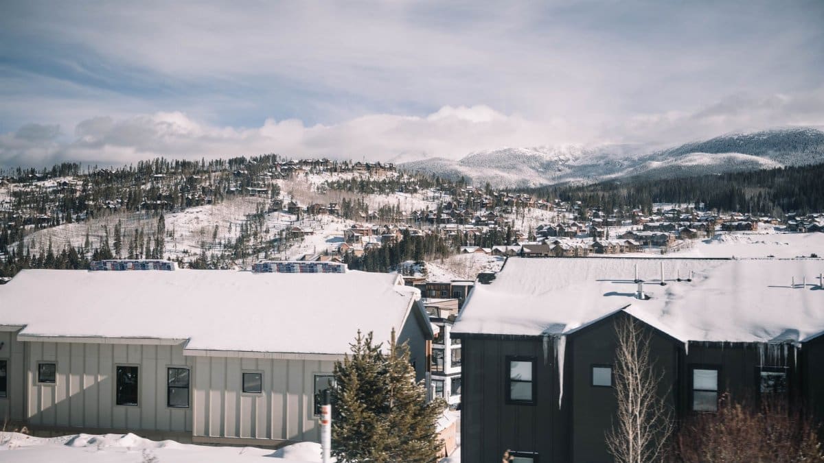 Beautiful winter scene of a snow-covered mountain town in Colorado with scenic views.