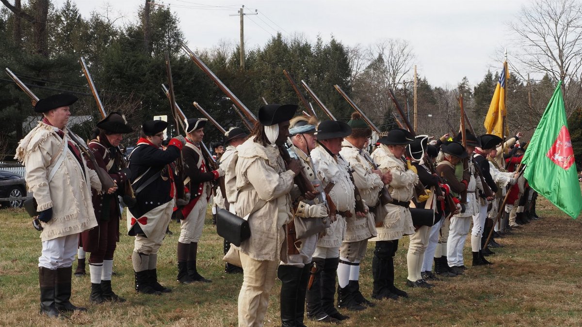 Historical reenactors depict Revolutionary War soldiers in Washington Crossing, PA.