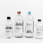 Studio shot of Purely Sedona water bottles in various sizes on a white background.