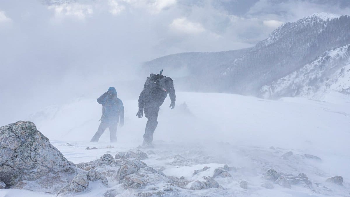 Adventurous hikers braving harsh winter conditions in the mountains of Bosnia.