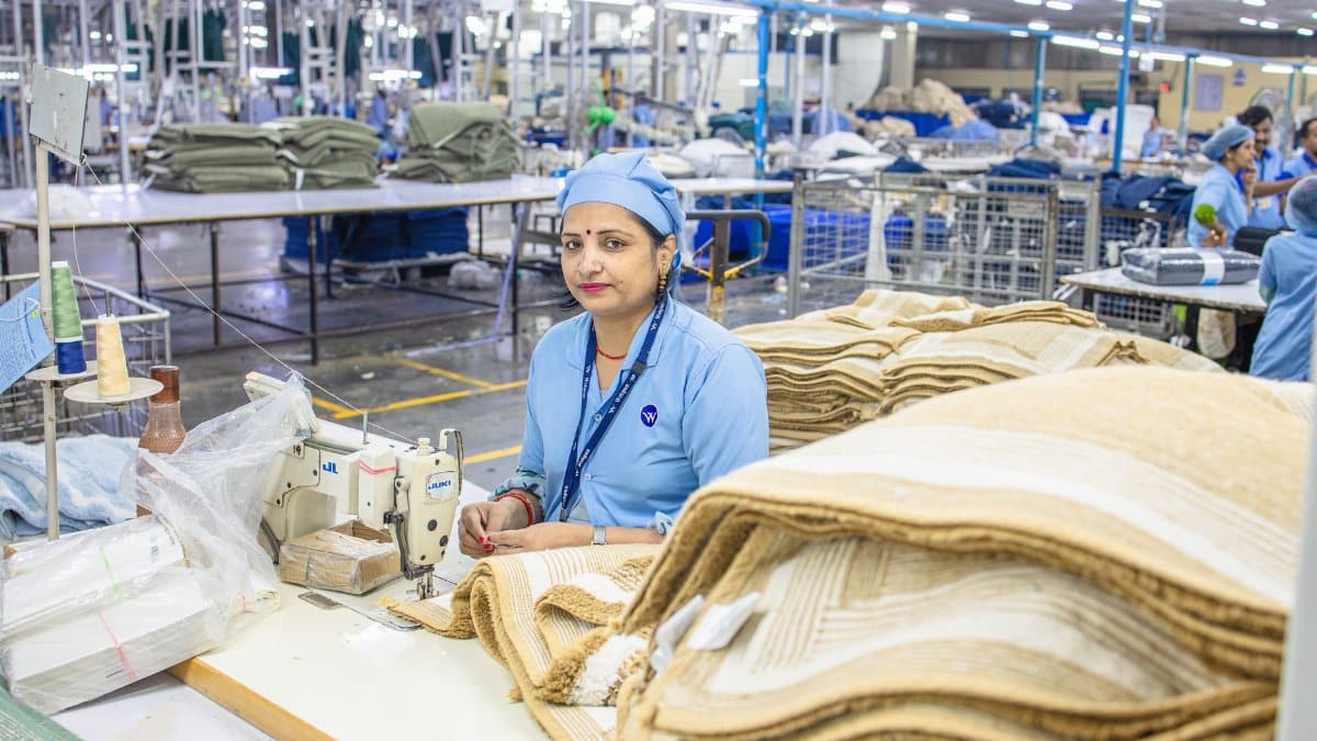 Indian factory worker in textile mill showcasing industrial production process.