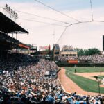 Panoramic view of a bustling baseball game at Wrigley Field, Chicago, capturing the vibrant atmosphere.