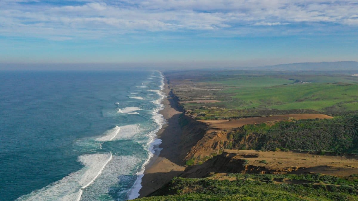 Breathtaking aerial view of Point Reyes National Seashore with sweeping coastline and lush landscapes.