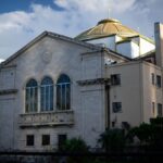 A beautiful historic church in Orlando, Florida, with a vibrant city backdrop.