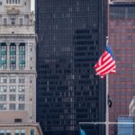 View of Boston's skyline featuring the iconic Custom House and American flag.