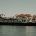Scenic view of a historic pier building in Milwaukee, Wisconsin, during fall by Lake Michigan.