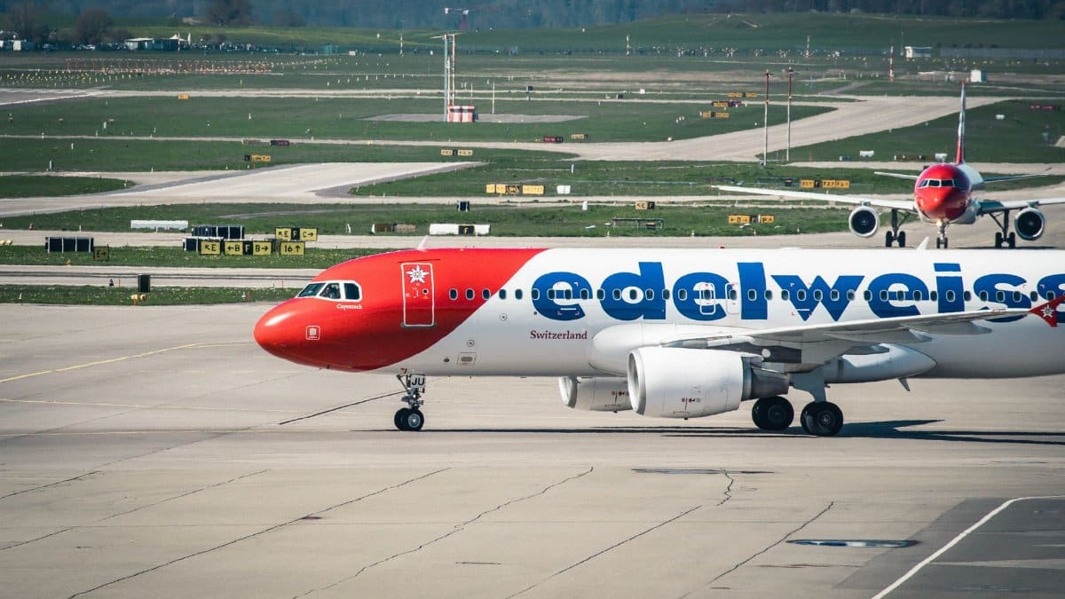 Edelweiss Air Airbus A320 on the tarmac at Zurich Airport in Switzerland, showcasing aviation and travel.