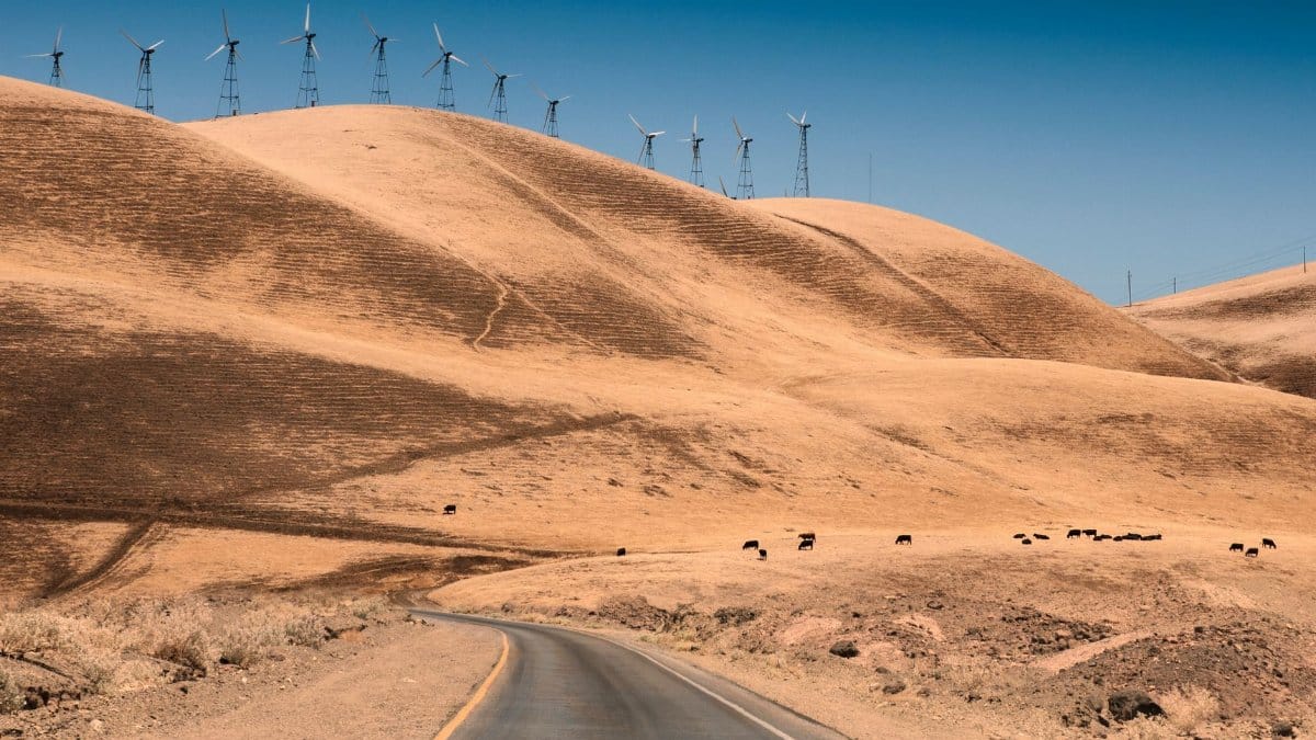 Scenic rural landscape with wind turbines on hills in California.