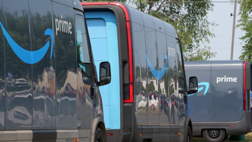Amazon Prime delivery vans lined up for logistics operations in an urban setting.