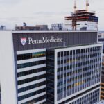 Aerial shot of Penn Medicine building in Philadelphia showcasing urban architecture.