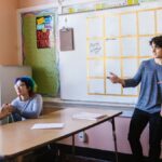 Students interacting in a high school classroom with a focus on engagement and collaboration.