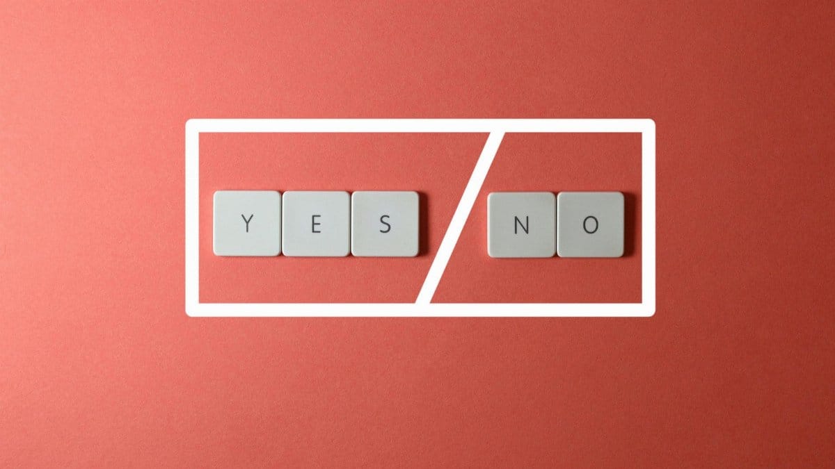Creative concept of decision making with YES and NO keys on a red background.