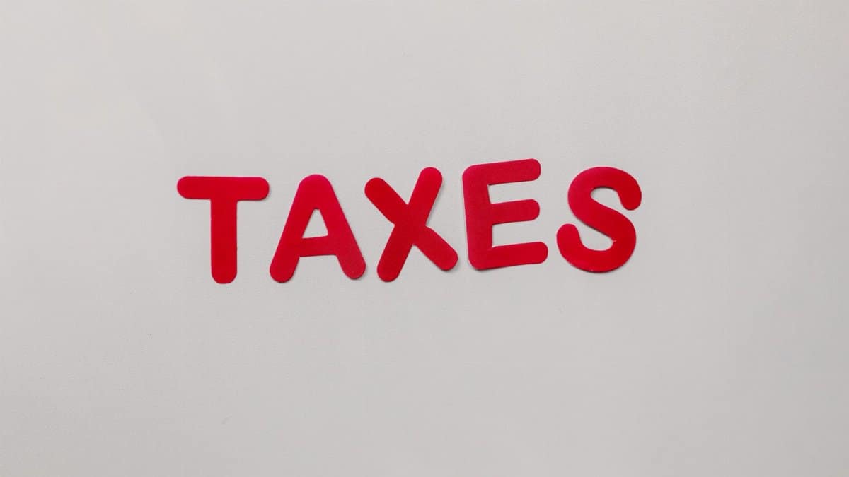 Simple and bold image of the word taxes in red letters on a white background.