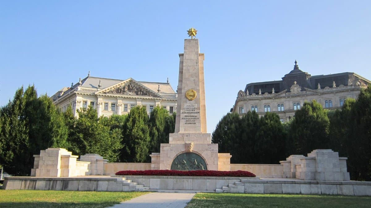 View of the Soviet War Memorial in Budapest, Hungary with historic buildings in the background.