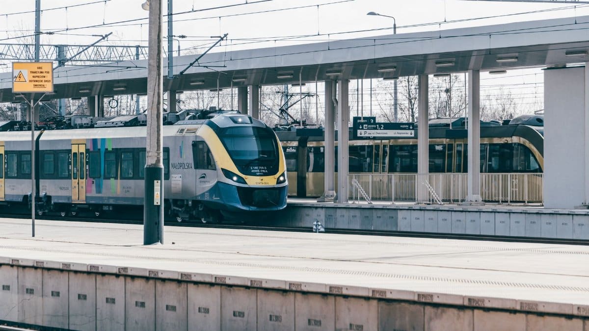 A passenger train at Trzebinia station in Poland, showcasing contemporary public transport.