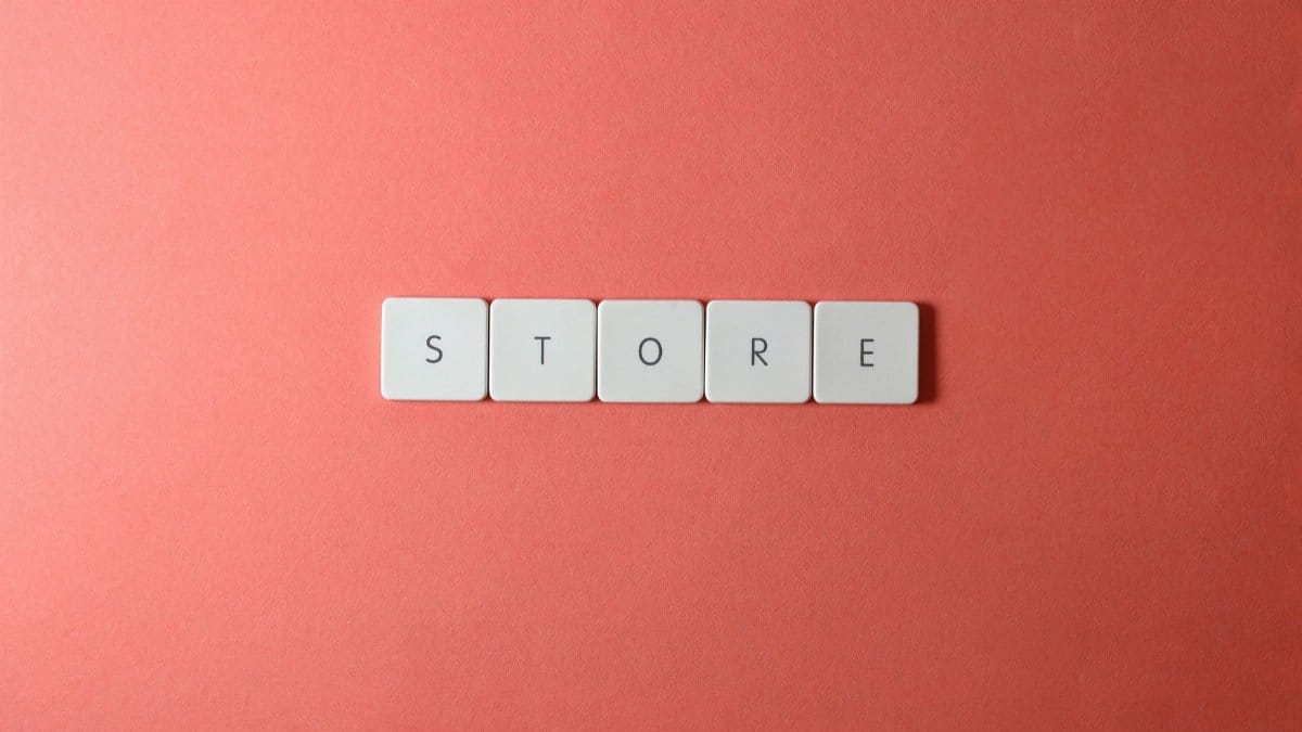 Minimalist conceptual image with 'STORE' spelled out on a red background, perfect for ecommerce themes.