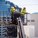 Construction workers perform exterior maintenance on a high-rise in Las Vegas.