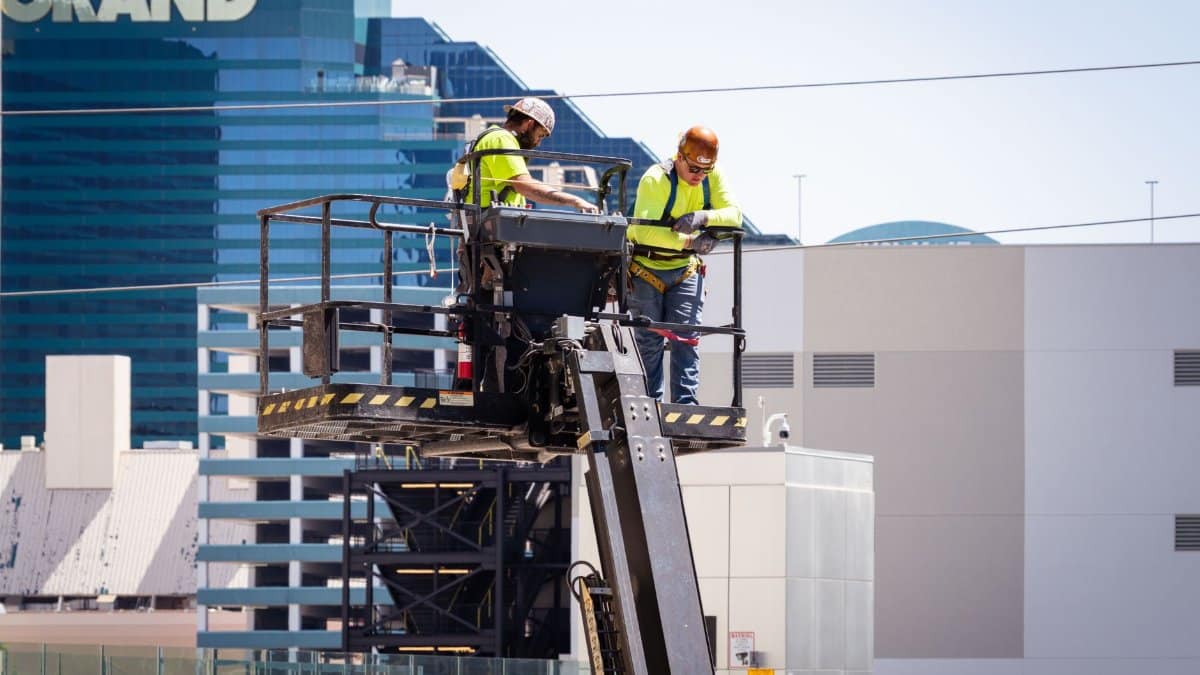 Construction workers perform exterior maintenance on a high-rise in Las Vegas.