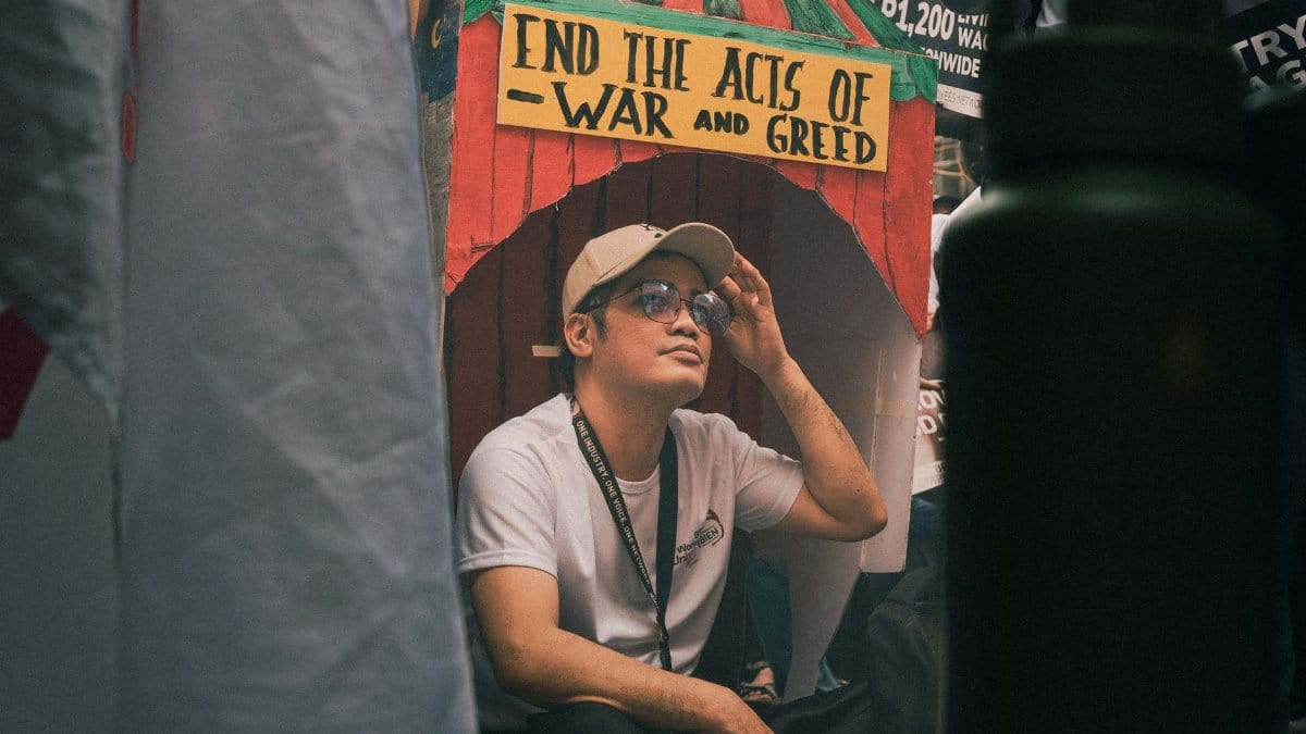A man participates in a protest against war and greed in Metro Manila, Philippines.