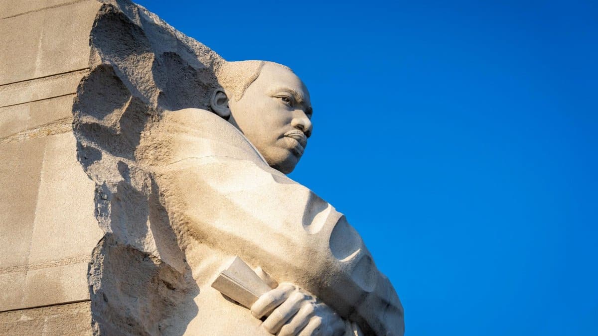 Monument of Martin Luther King Jr. against a clear blue sky, symbolizing hope and leadership.