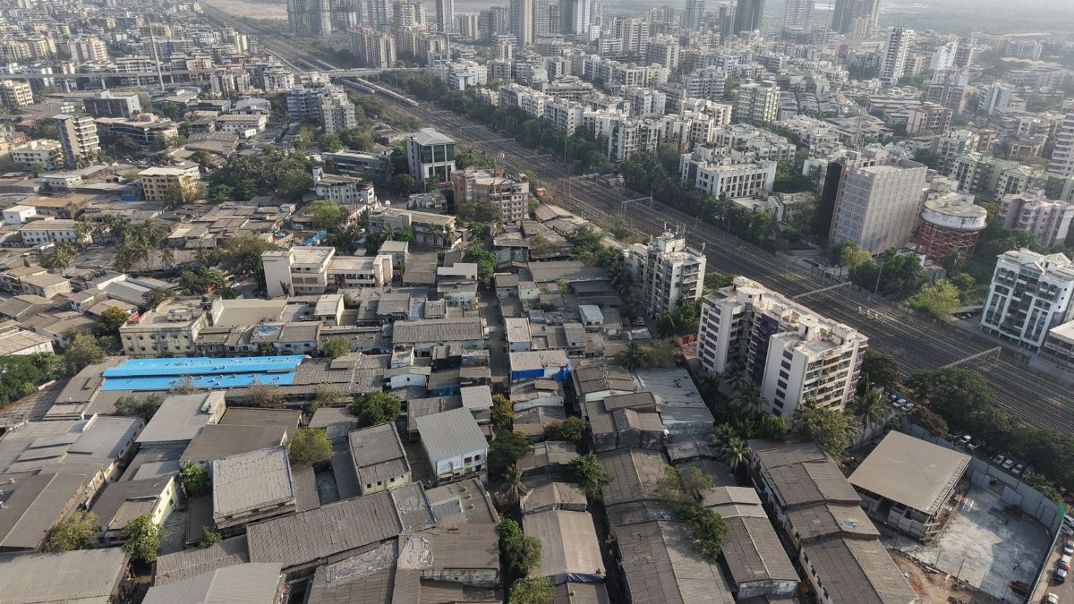 Aerial view of a bustling urban landscape in Mumbai, showcasing city architecture and skyline.