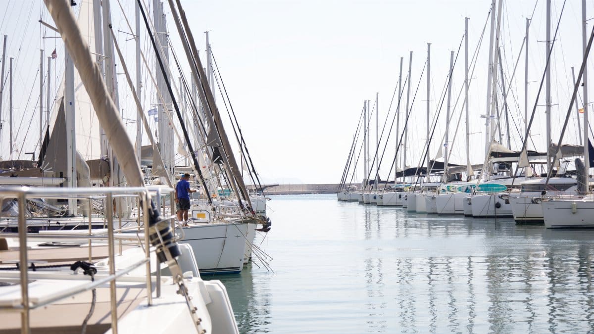 Serene view of sailboats docked in Athens, Greece under a clear sky. Perfect for travel inspiration.