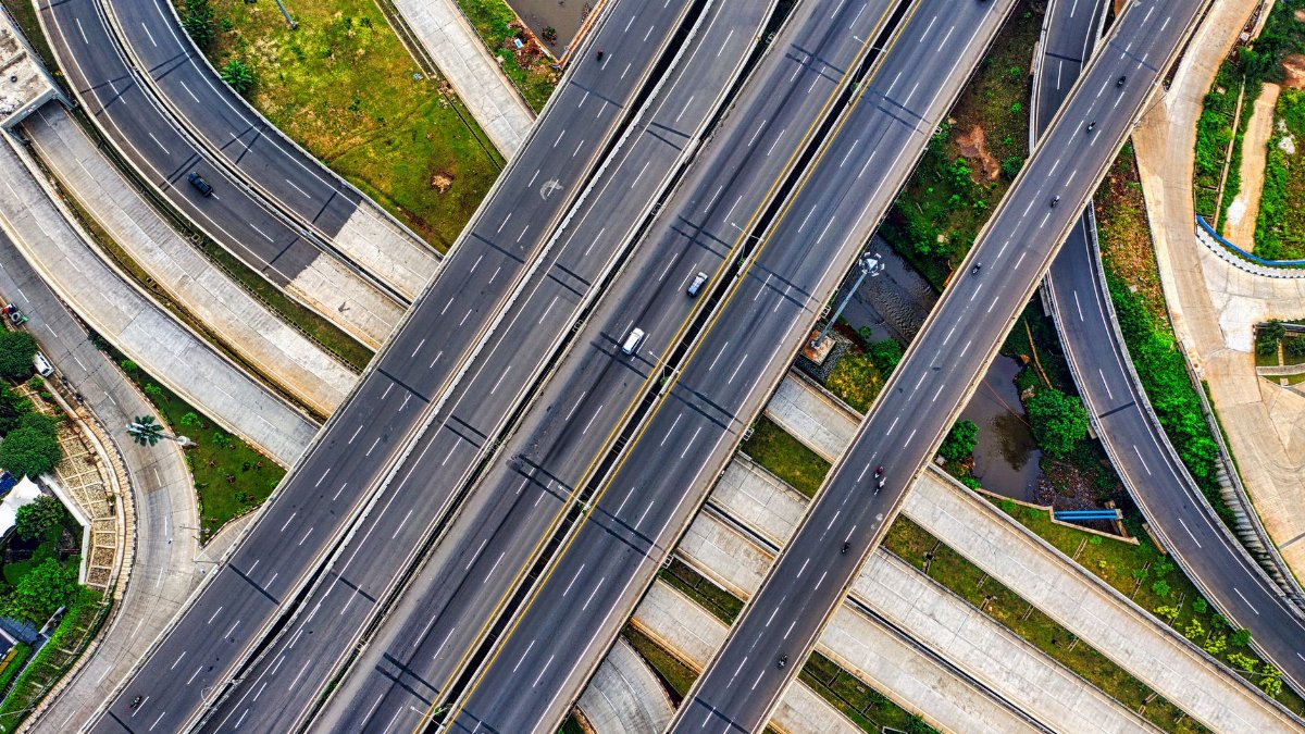 Aerial view of a complex highway interchange in South Jakarta, Indonesia, depicting urban infrastructure.