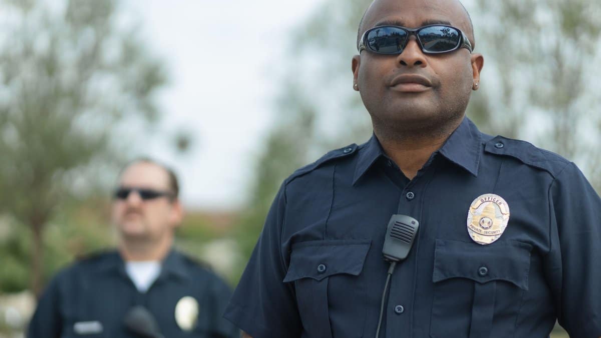 Police officers standing outdoors ensuring public safety. Law enforcement teamwork and professionalism.