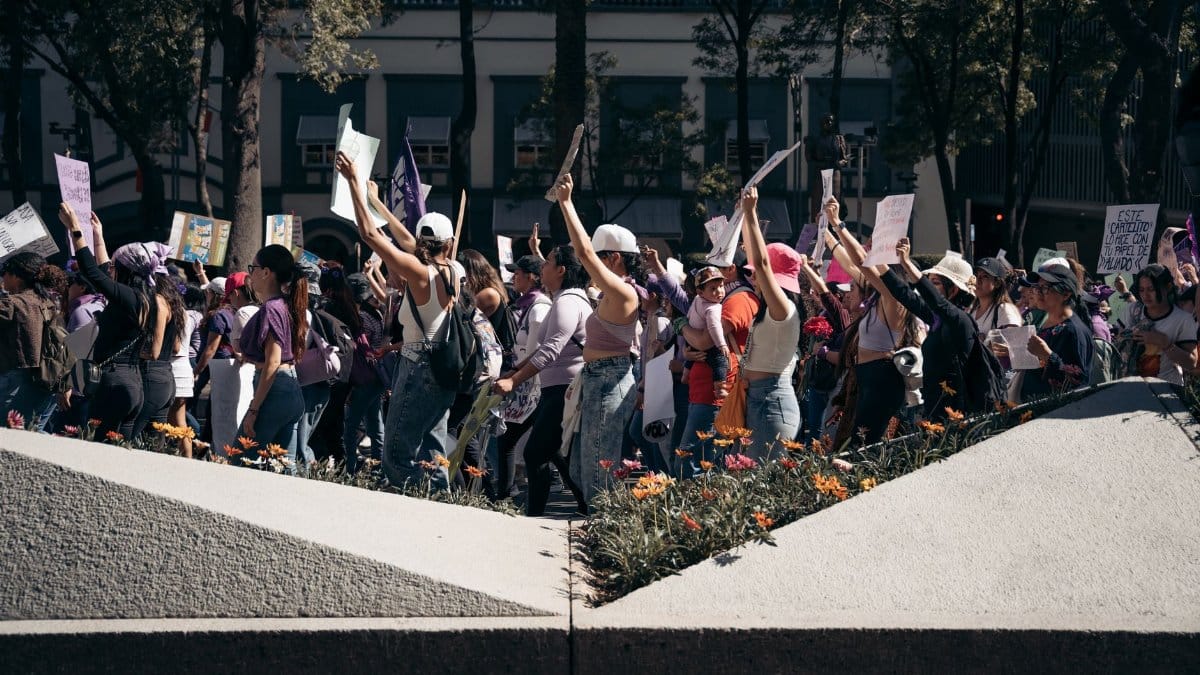 Crowd in a peaceful demonstration in Mexico City, highlighting social activism and unity in urban setting.