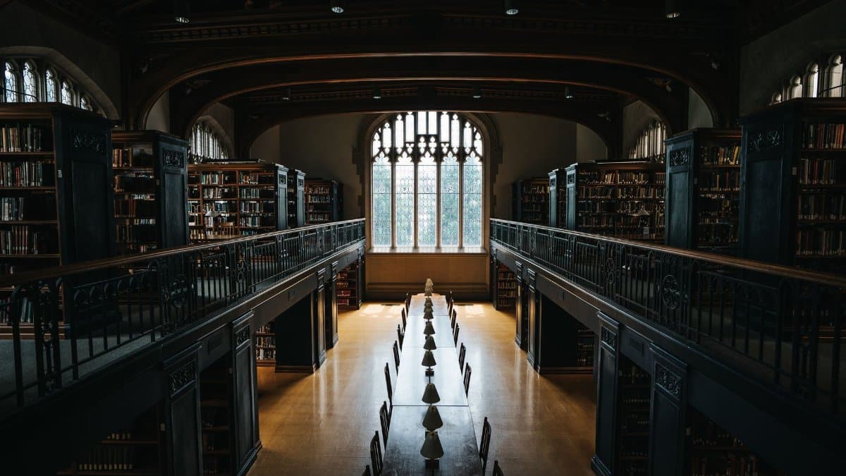 Historic gothic-style library interior at Vassar College, New York, with ambient lighting and quiet atmosphere.