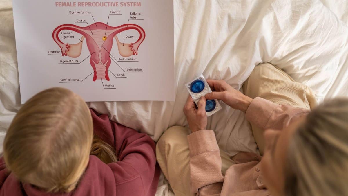 A mother and daughter learning about female reproductive health and contraception.
