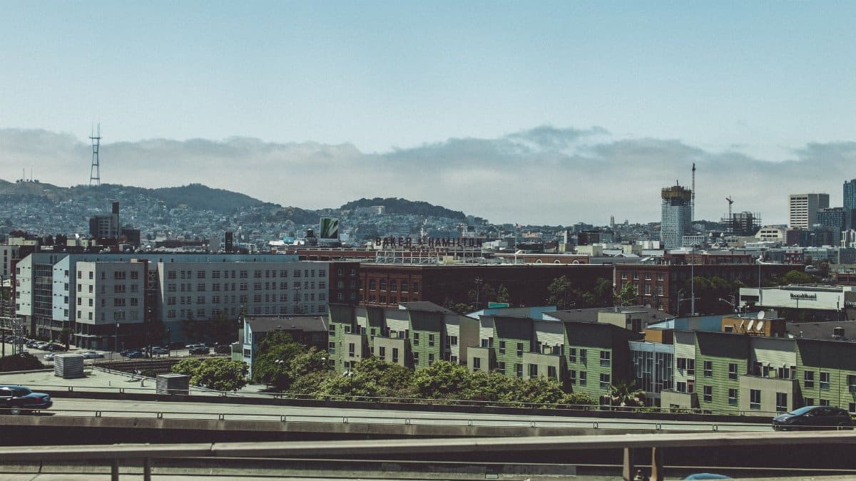 Cityscape view of San Francisco featuring Sutro Tower and residential buildings.
