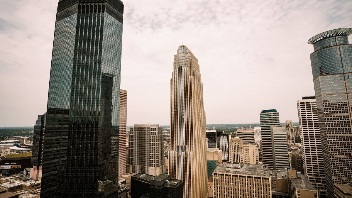 Aerial view of Minneapolis skyline featuring Wells Fargo Center and other skyscrapers.