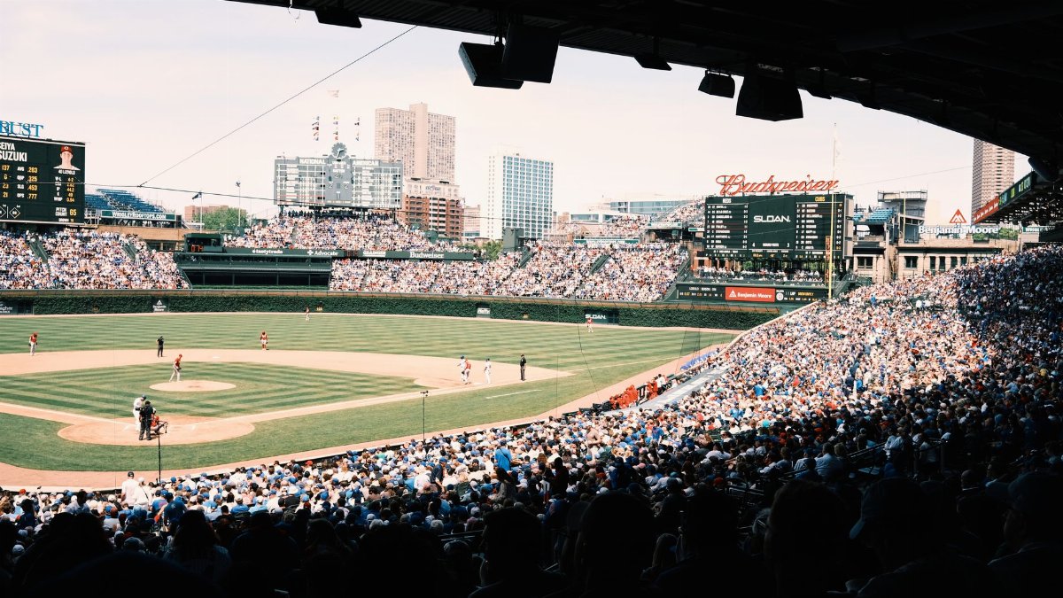 A lively baseball game at Wrigley Field with a packed crowd in Chicago, Illinois.