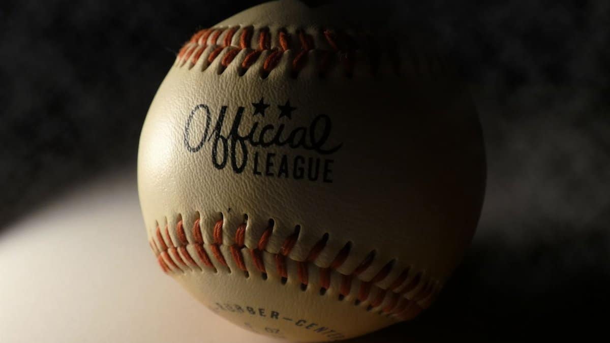 High-quality close-up of an Official League baseball, showcasing intricate stitching and texture.