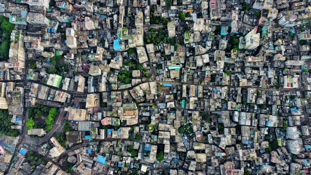 Aerial shot of a densely packed urban cityscape highlighting architecture and city planning.