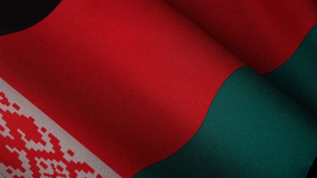 A close-up of the Belarusian flag showing its vibrant colors and intricate patterns.