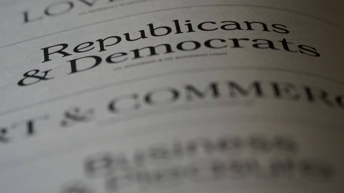 Close-up of blurred text page with 'Republicans & Democrats', focusing on political themes.