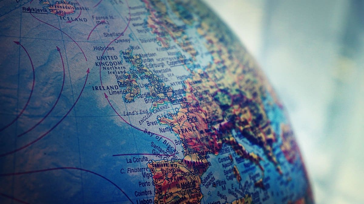 Detailed close-up of a globe showing parts of Europe and the Atlantic Ocean.