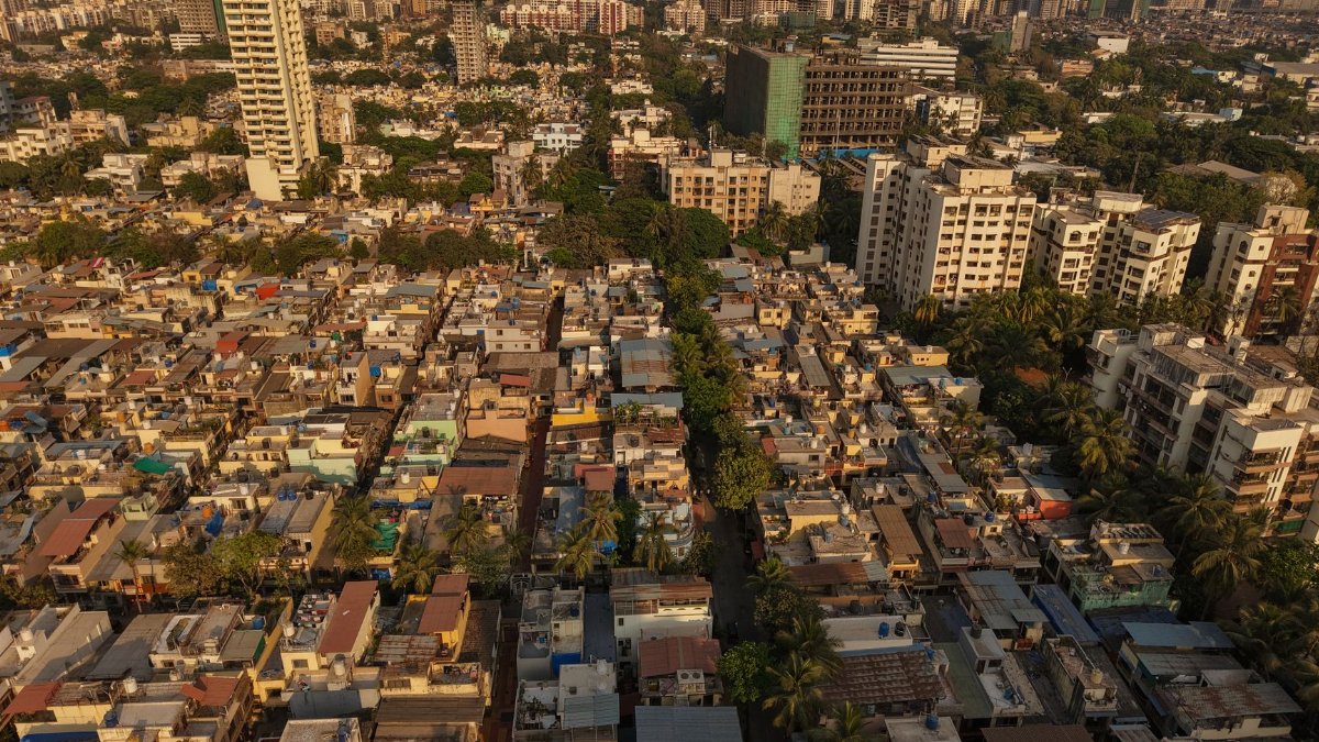 Aerial panorama of Mumbai's diverse architecture showcasing urban skyscrapers and dense residential areas.