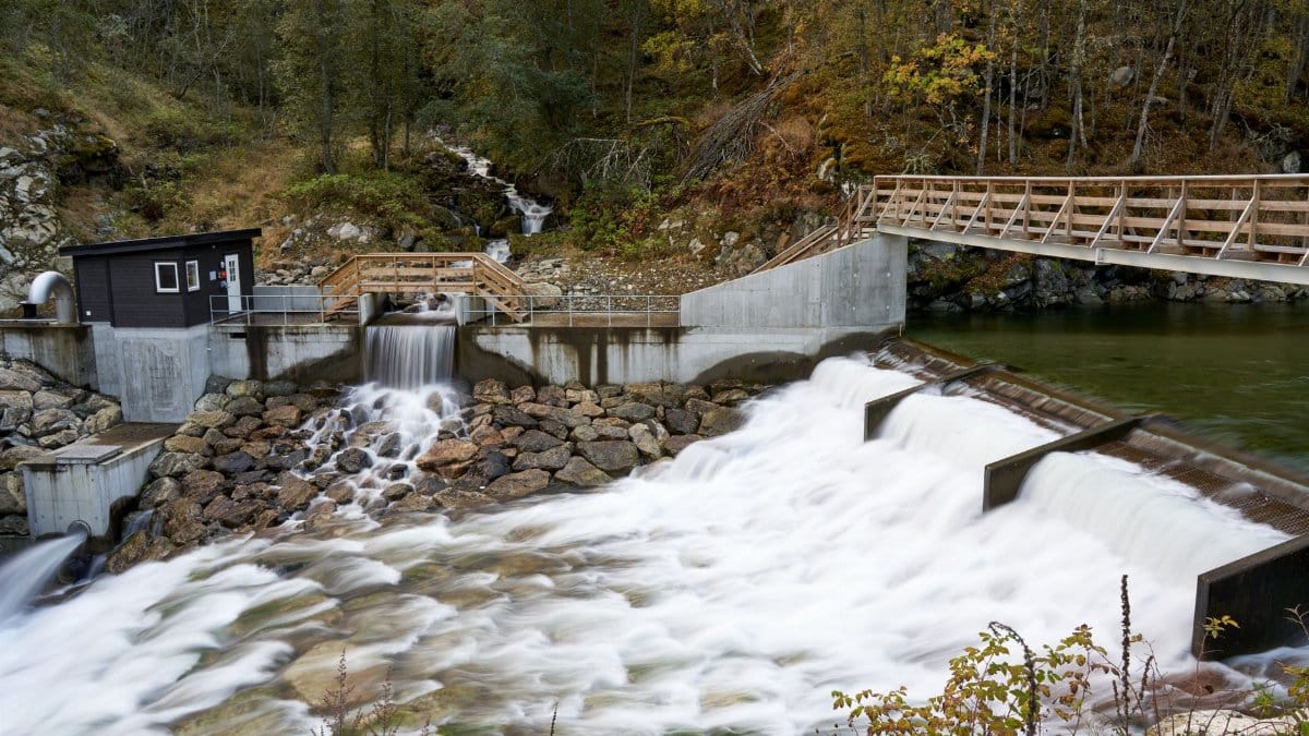 Scenic view of Mork Power Plant harnessing clean energy from the river in Norway.